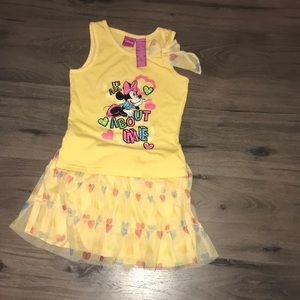 A Disney outfit that is a shirt and a skirt